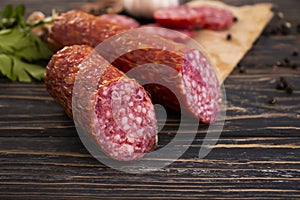 Sausage , gastron delicatessen appetizer foodstuff protein on Ð´ÐµÑ€ÐµÐ²ÑÐ½Ð½Ð¾Ð¼ background sliced gourmet